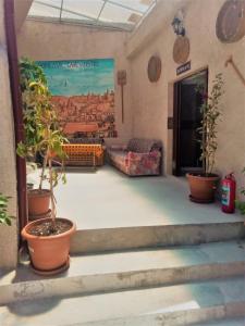 a room with a patio and a large window at Homestay Cave Hostel in Goreme