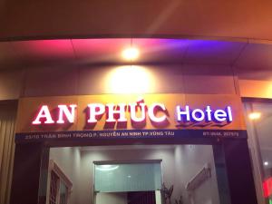 a neon sign on the side of a hotel at An Phuc Hotel in Vung Tau