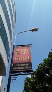 a sign for a hotel on the side of a building at An Phuc Hotel in Vung Tau