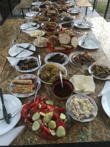 a table full of plates of food on a table at Guest House 293 in Kobuleti