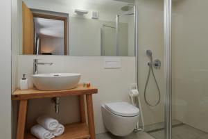 a bathroom with a sink and a shower at Pension Kristian by KH in Český Krumlov