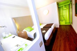 Postel nebo postele na pokoji v ubytování Campanile Hôtel Auch