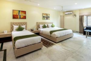 מיטה או מיטות בחדר ב-Sher-E-Punjab