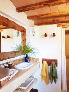 a bathroom with a sink and a mirror at Agroturismo Ca na Joaneta in Santa Eularia des Riu