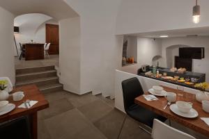 a dining room and kitchen with a table and chairs at Pension Kristian by KH in Český Krumlov +31 photos