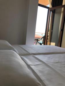 Letto o letti in una camera di M-Rooms