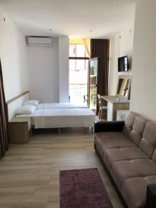Letto o letti in una camera di M-Rooms