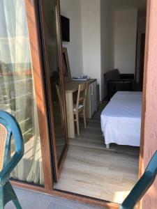 Letto o letti in una camera di M-Rooms
