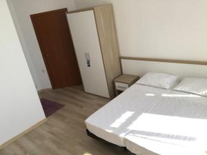 Letto o letti in una camera di M-Rooms