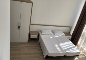 Letto o letti in una camera di M-Rooms