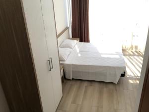 Letto o letti in una camera di M-Rooms