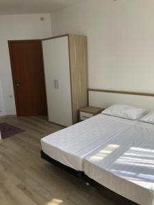 Letto o letti in una camera di M-Rooms