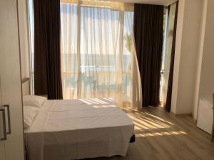 Letto o letti in una camera di M-Rooms