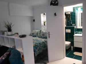 a bathroom with a bed and a toilet and a sink at Apartments Paris in Umag +79 photos