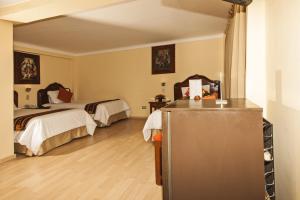 Voodi või voodid majutusasutuse Hotel Agustos Cusco toas