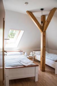 Llit o llits en una habitació de Penzion-apartmán Souček