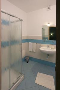 a bathroom with a shower and a sink at Rotte e Sentieri B&B in Castelluzzo +40 photos