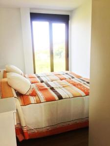 Posteľ alebo postele v izbe v ubytovaní viviendas de uso turístico FINISTERRAE FARO