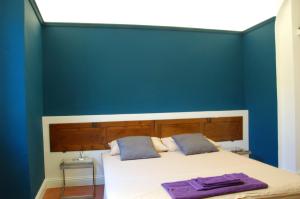 Posteľ alebo postele v izbe v ubytovaní BORGO SAN FREDIANO SUITES