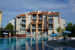 a swimming pool in front of a apartment building at Elite Apartments in Sunny Beach