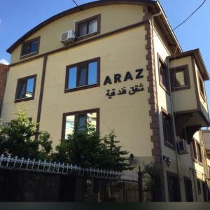 a building with an araza sign on the side of it at Araz Apart in Bursa