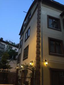 a building with lights on the side of it at Araz Apart in Bursa