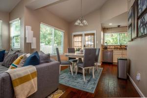 a living room with a couch and a table at Comfortable, Family and Business Friendly 2BD/2BA House in North Austin in Austin
