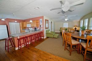 a kitchen and living room with a table and chairs at DeSoto Beach Terraces in Tybee Island