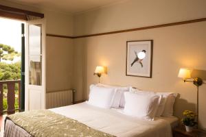 Postel nebo postele na pokoji v ubytování Hotel Toriba