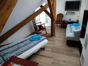 Postel nebo postele na pokoji v ubytování Kisfaludy Sándor Apartman