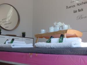 a pile of towels sitting on top of a bed at George apartments in Kallithea Halkidikis +36 photos