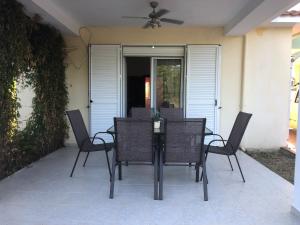 a table and chairs sitting on a patio at Anna House Palouri in Paliouri