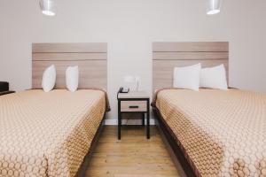 Postel nebo postele na pokoji v ubytování Palace Inn- Louetta
