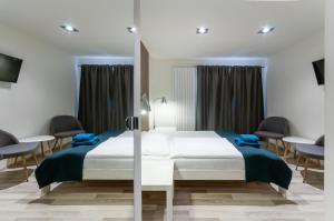 Postel nebo postele na pokoji v ubytování VV hotel & apartments
