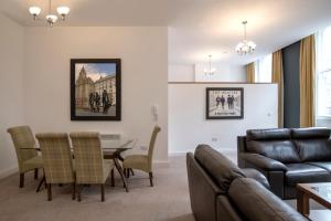 a living room with a couch and a table at The Castle Collection - 25 Castle Street in Liverpool