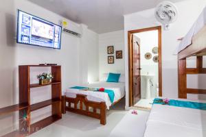 Ένα ή περισσότερα κρεβάτια σε δωμάτιο στο Casa Hotel La Mariela +20 φωτογραφίες