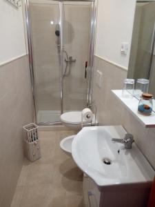 a bathroom with a shower and a sink and a toilet at Silvi d'aMare in Silvi Marina +24 photos