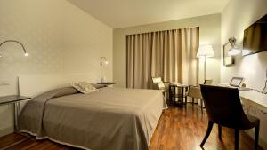 Posteľ alebo postele v izbe v ubytovaní Hotel Datini + 37 fotografií