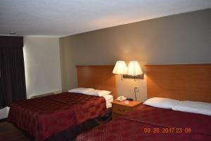 Postel nebo postele na pokoji v ubytování MHO Hotel Bordentown
