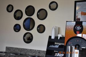 a wall with a bunch of circles on the wall at MHO Hotel Bordentown in Bordentown