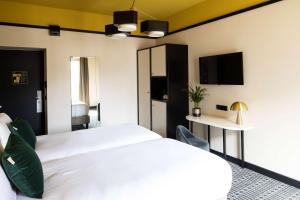 Postel nebo postele na pokoji v ubytování Best Western Premier Hotel Roosevelt