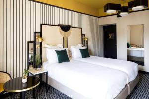 Postel nebo postele na pokoji v ubytování Best Western Premier Hotel Roosevelt