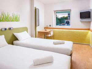 Postel nebo postele na pokoji v ubytování ibis budget Southampton Centre + 34 fotografií