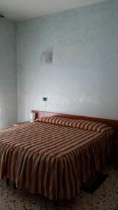 Postel nebo postele na pokoji v ubytování Hotel Frejus