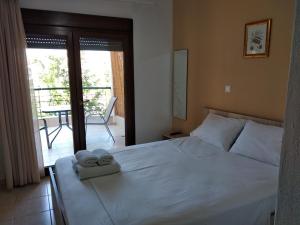 A bed or beds in a room at Angelo Studios