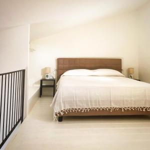 Un pat sau paturi într-o cameră la Alloggio Turistico Vigna Clara