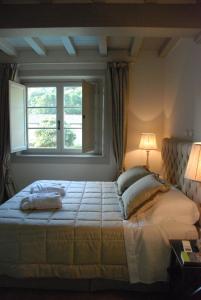 A bed or beds in a room at B&B Pieve Degli Artisti