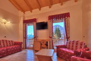 TV a/nebo společenská místnost v ubytování Albergo San Rocco