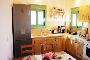 A kitchen or kitchenette at luxurious apartments Angelina