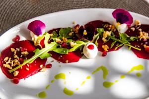 a white plate with some food on it at Windtown Lagoon Hotel in Langebaan